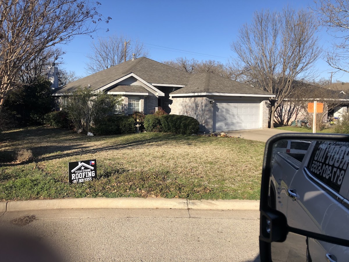 Completed shingle roof on a Weatherford home
