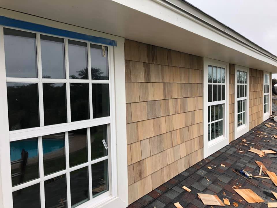 Cedar shake siding and new windows installed by Rafter T